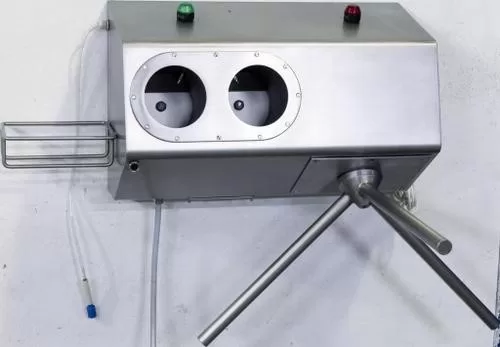 Hand disinfection station with turnstile